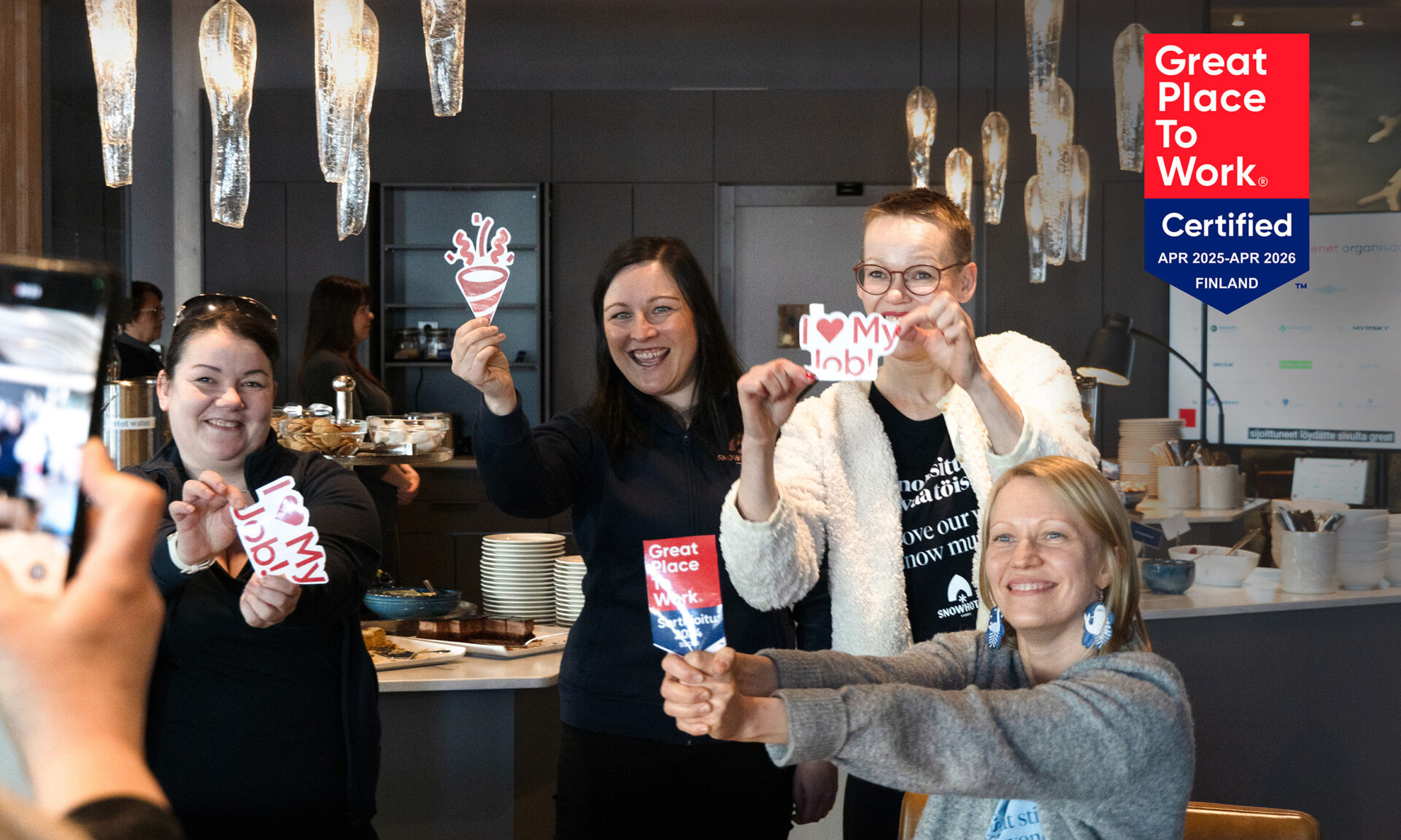 Snowhotel Family members celebrating ranking in Great place to work listing