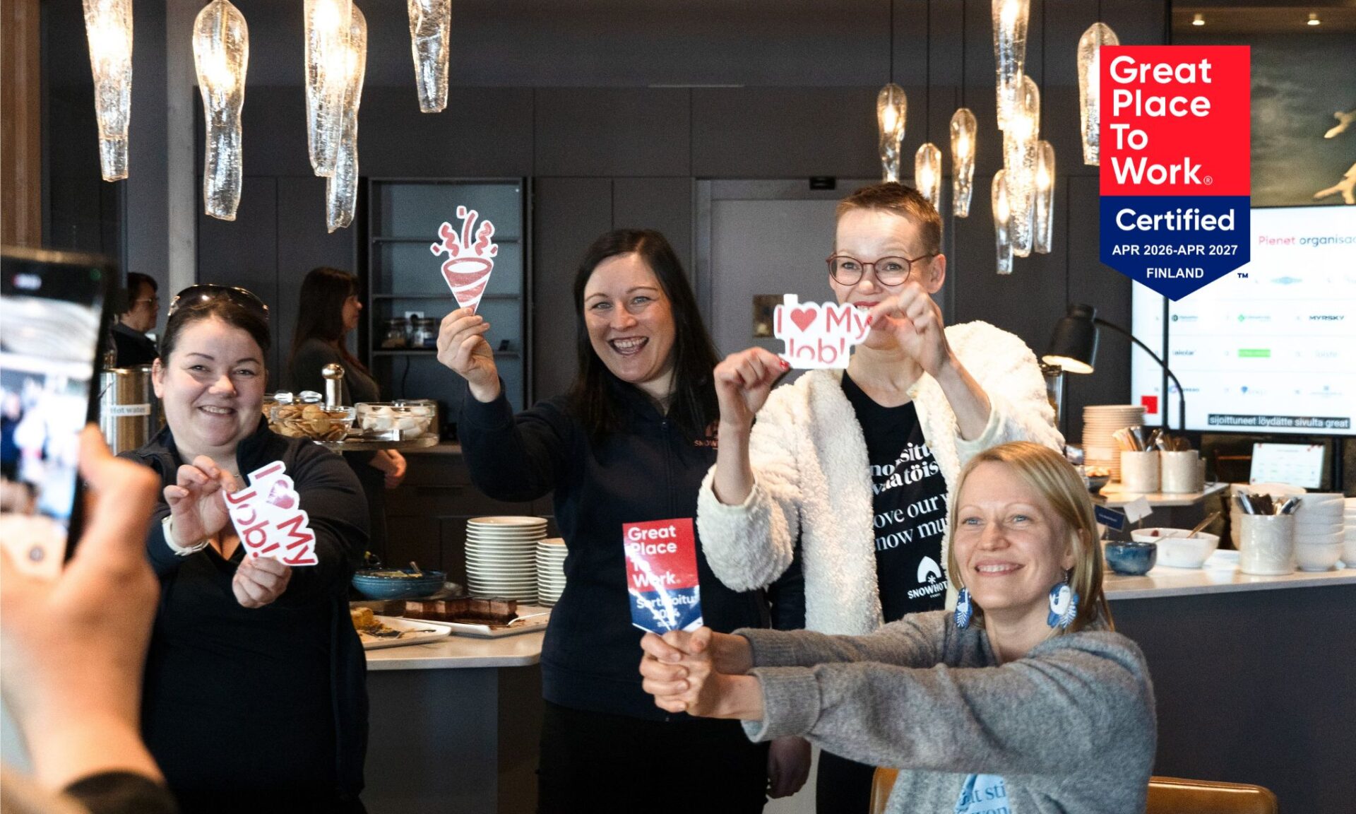 Snowhotel Family members celebrating ranking in Great place to work listing